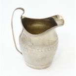 A Geo III silver cream jug, hallmarked London 1798 maker John Merry. Approx 4 1/2" high Please