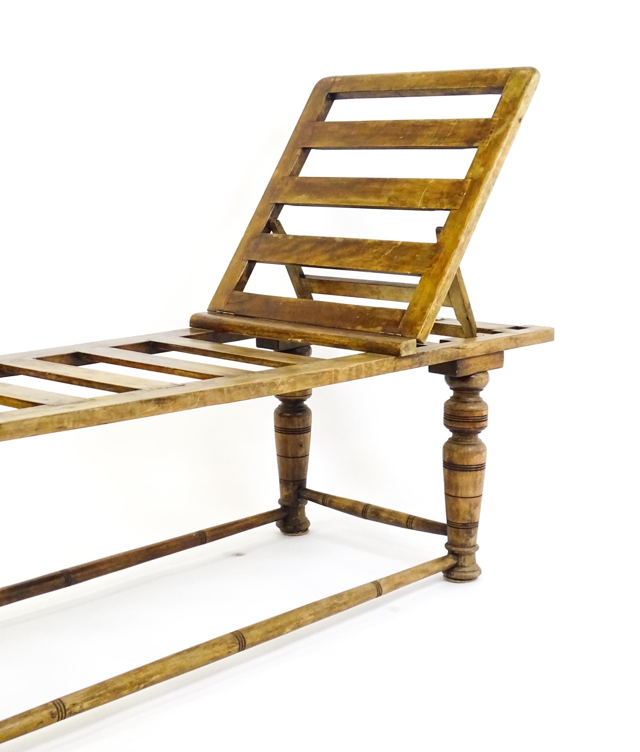 A late 19thC 'Leveson & Sons' campaign bed /day bed with a slatted bed and adjustable headrest above - Image 4 of 9