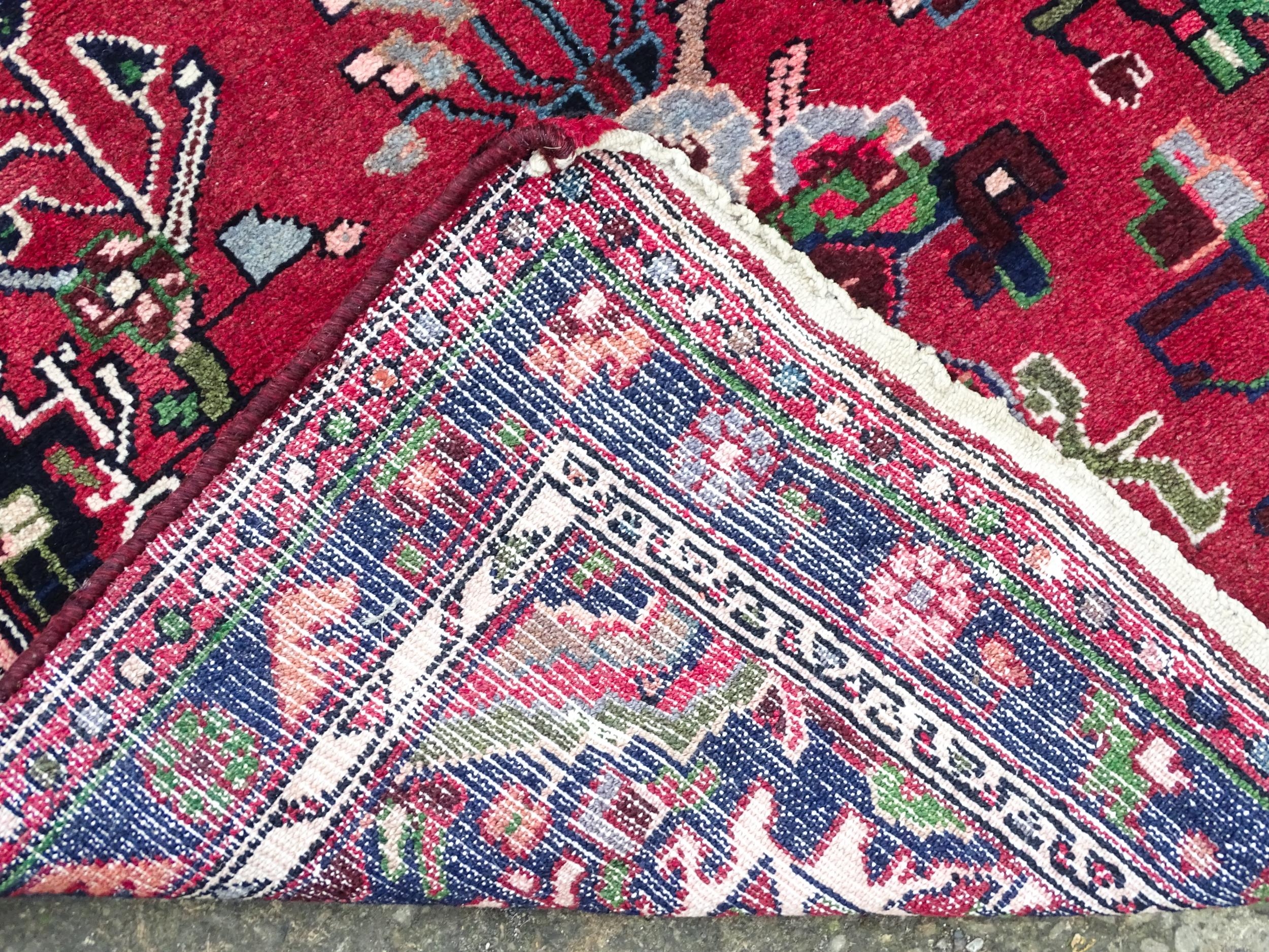 Carpet / Rug : A Persian Hamadan runner, the red ground with central cream ground medallion with - Image 3 of 8