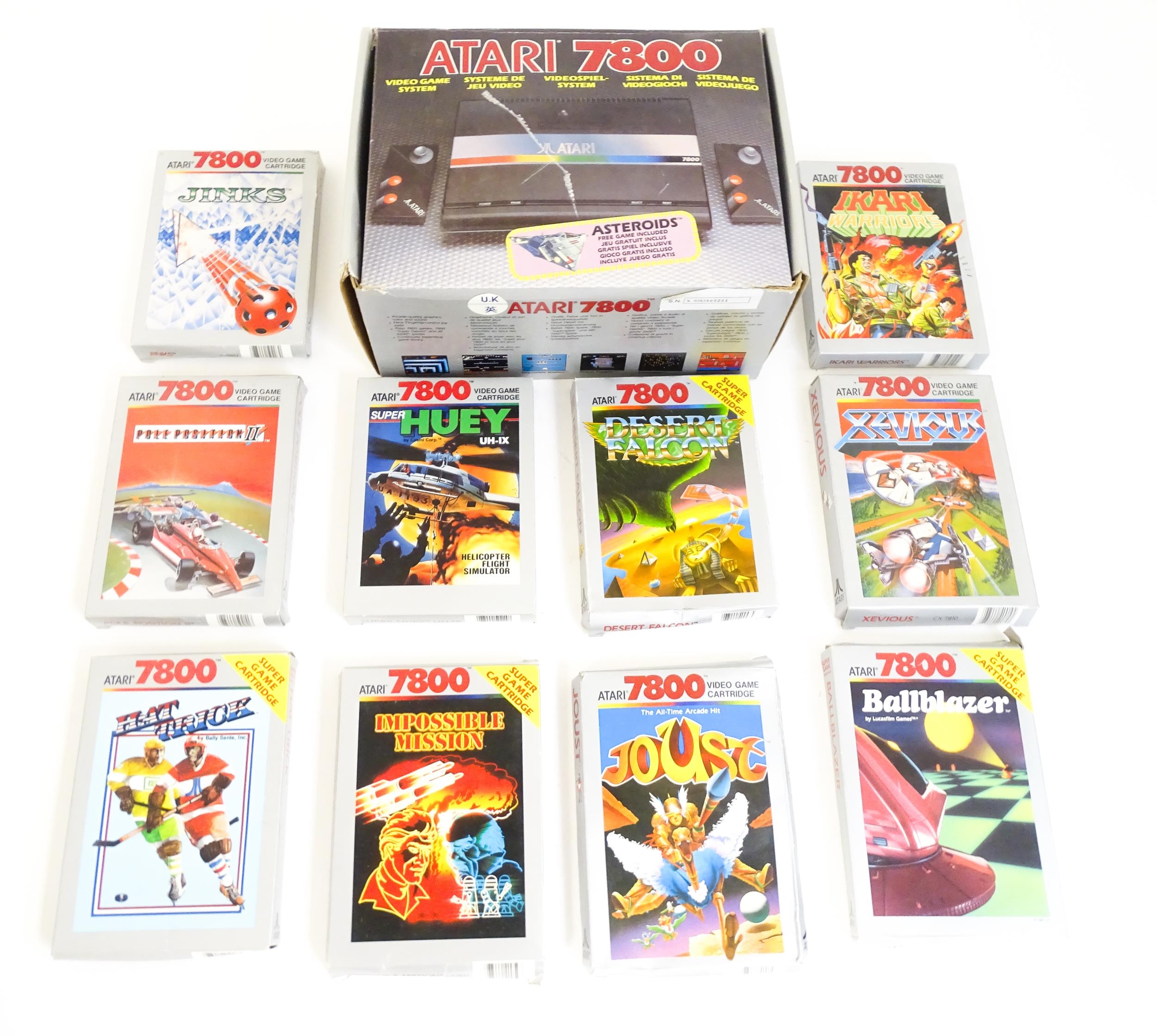 Toys: An Atari 7800 video game console. Together with games cartridges comprising Jinks, Xevious,