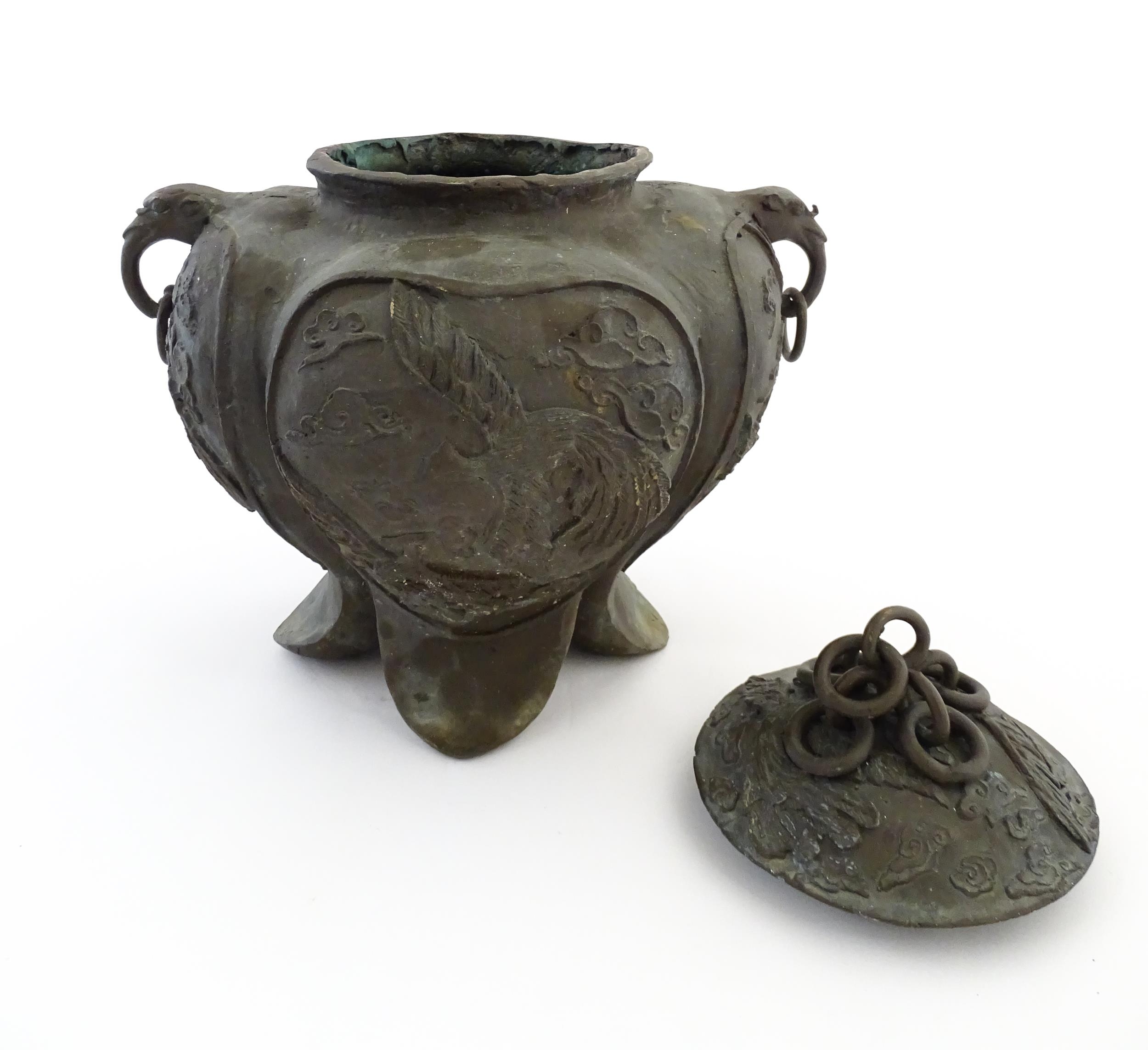 A Chinese cast vessel of lobed form with twin ring handles modelled as elephant heads, the body - Image 5 of 9