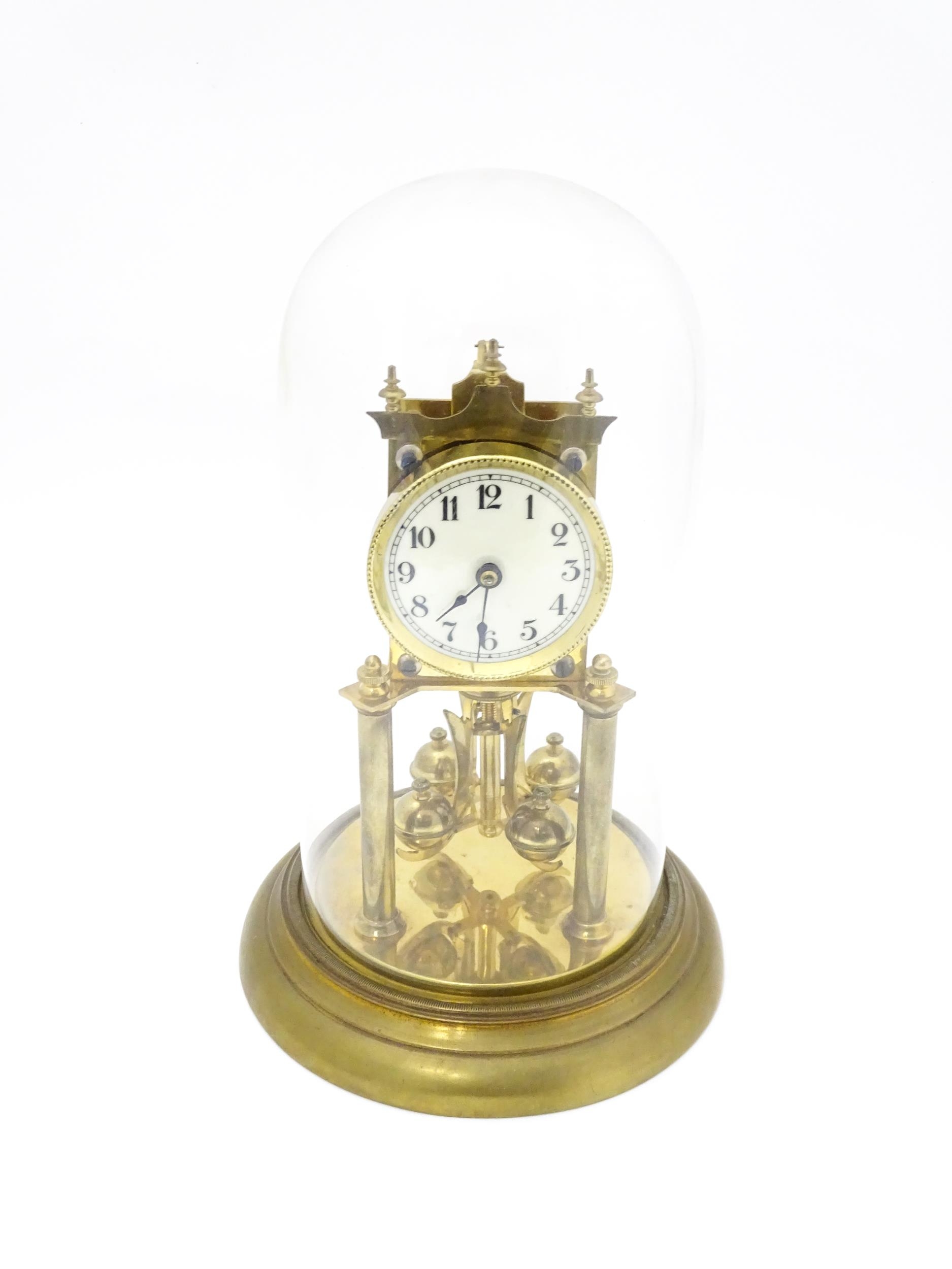 A 20thC anniversary / table clock with white enamel dial and Roman numerals. Under glass dome - Image 3 of 12