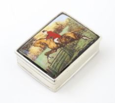 A .925 silver pill box with hunting scene depicting huntsman on horse to lid. 1 1/2" wide. Please