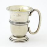 A silver mug with loop handle and gilded interior, hallmarked Birmingham 1925, maker Napper &