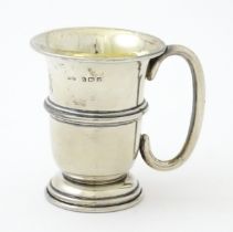 A silver mug with loop handle and gilded interior, hallmarked Birmingham 1925, maker Napper &