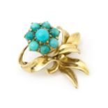 A 9ct gold brooch of floral form with turquoise detail. By Bernard Instone (Langstone Silver