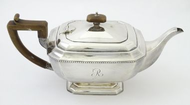 An Art Deco silver teapot hallmarked Birmingham 1932, maker Henry Clifford Davis. Approx. 12" wide