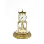 A 20thC anniversary / table clock with white enamel dial and Roman numerals. Under glass dome