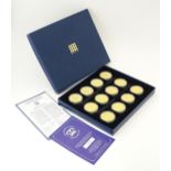 Coins: A boxed set of twelve Westminster Mint gold plated medallions titled the Crown Jewels Coin