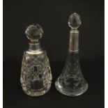 Two cut glass scent / perfume bottles with silver mounts, one hallmarked Birmingham 1921, maker A