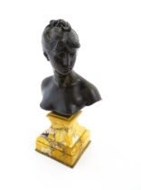 A 19thC cast bronze bust of the goddess Diana, after Mathurin Moreau, raised on a marble socle. Cast