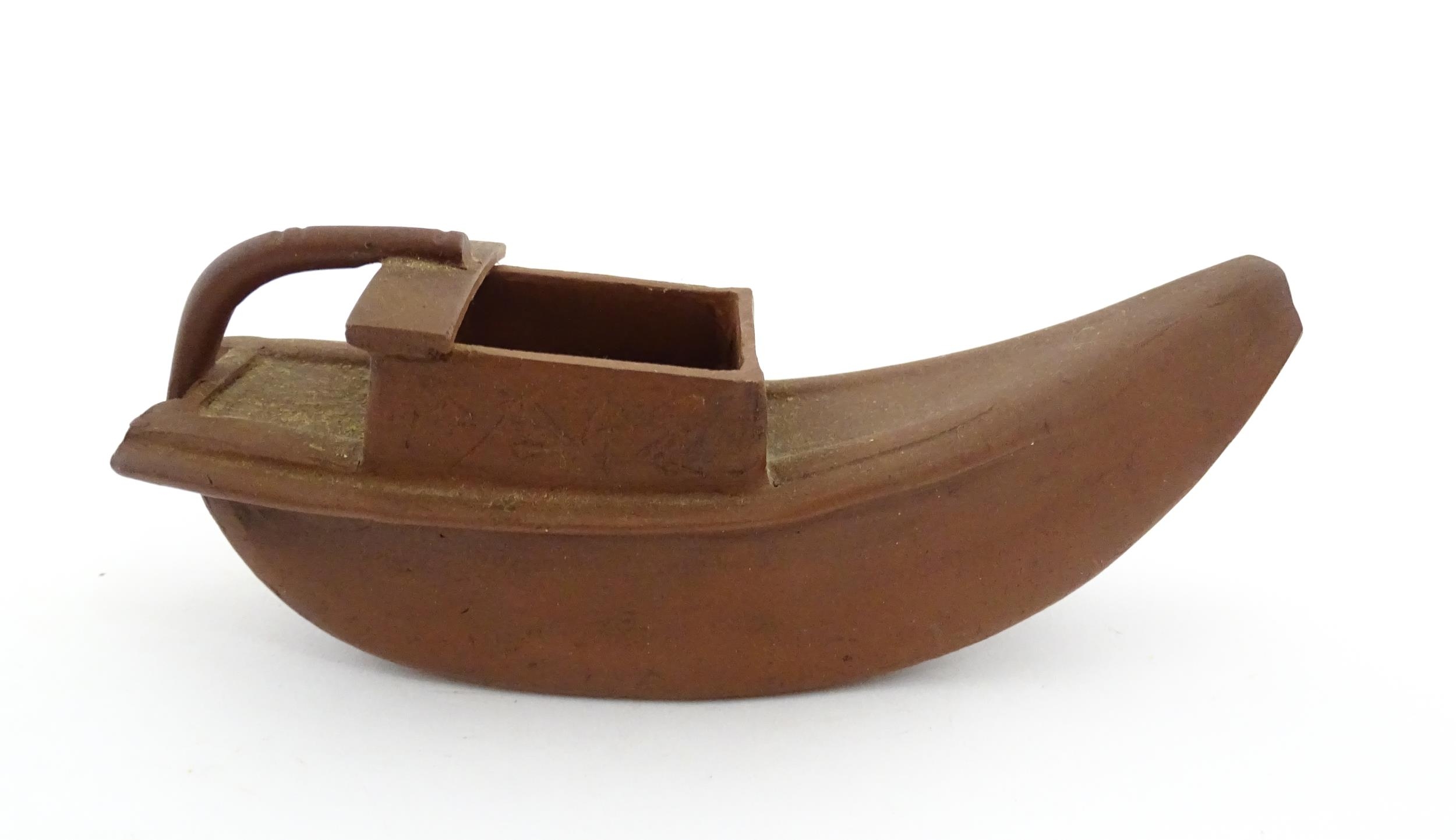 A Chinese Yixing teapot modelled as a boat with incised Character marks and Character seal under. - Image 6 of 8
