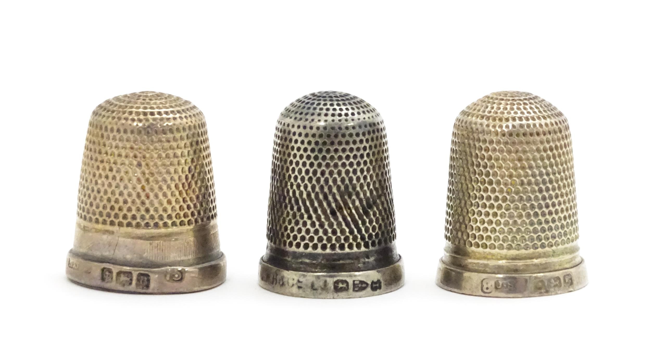 Three silver thimbles hallmarked Birmingham 1926 maker Northern Goldsmiths Co., Chester 1892 maker G