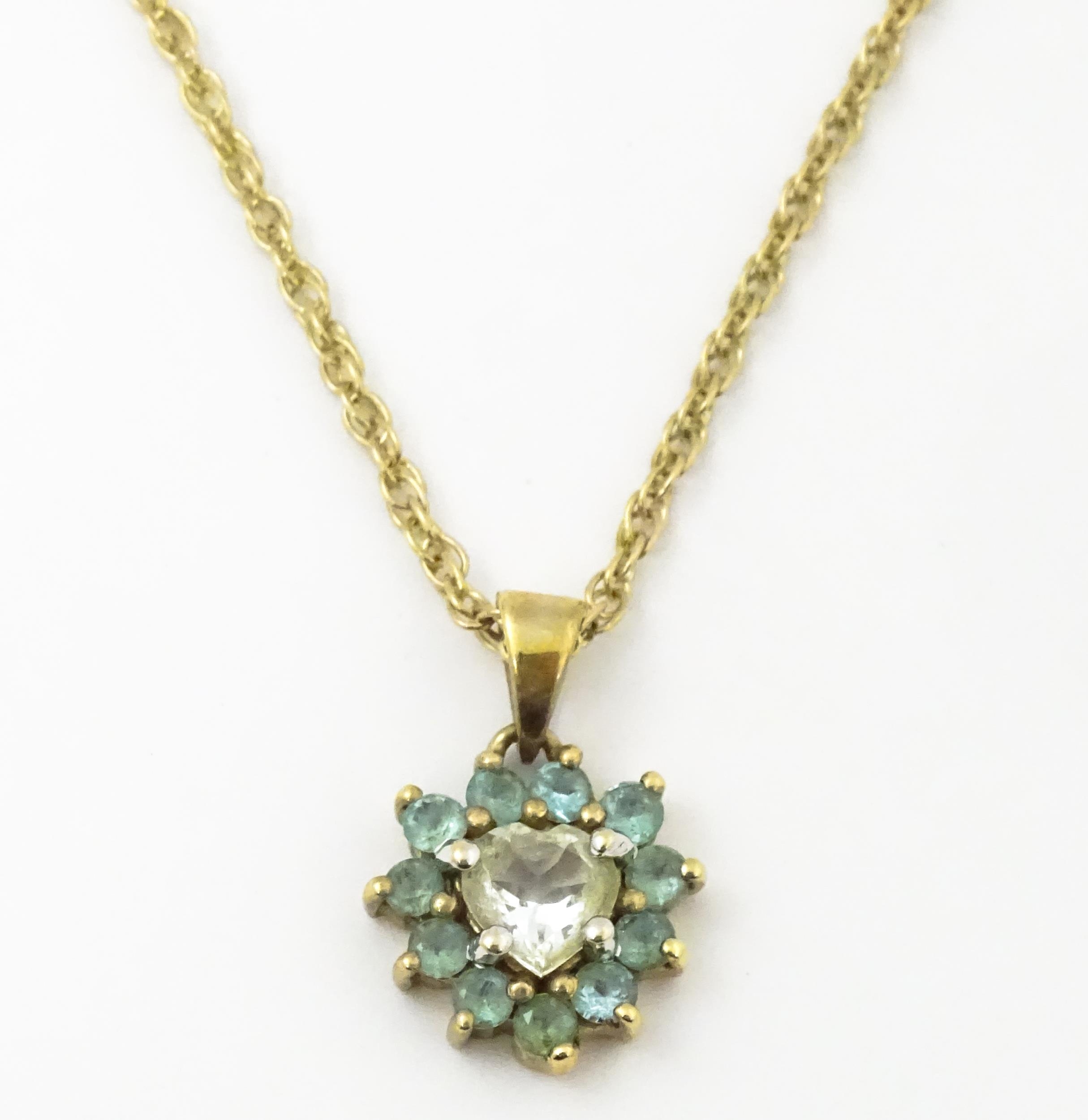 9ct gold pendant set with white and aqua coloured stones, with chain necklace. The chain approx