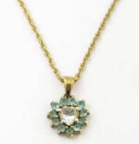 9ct gold pendant set with white and aqua coloured stones, with chain necklace. The chain approx
