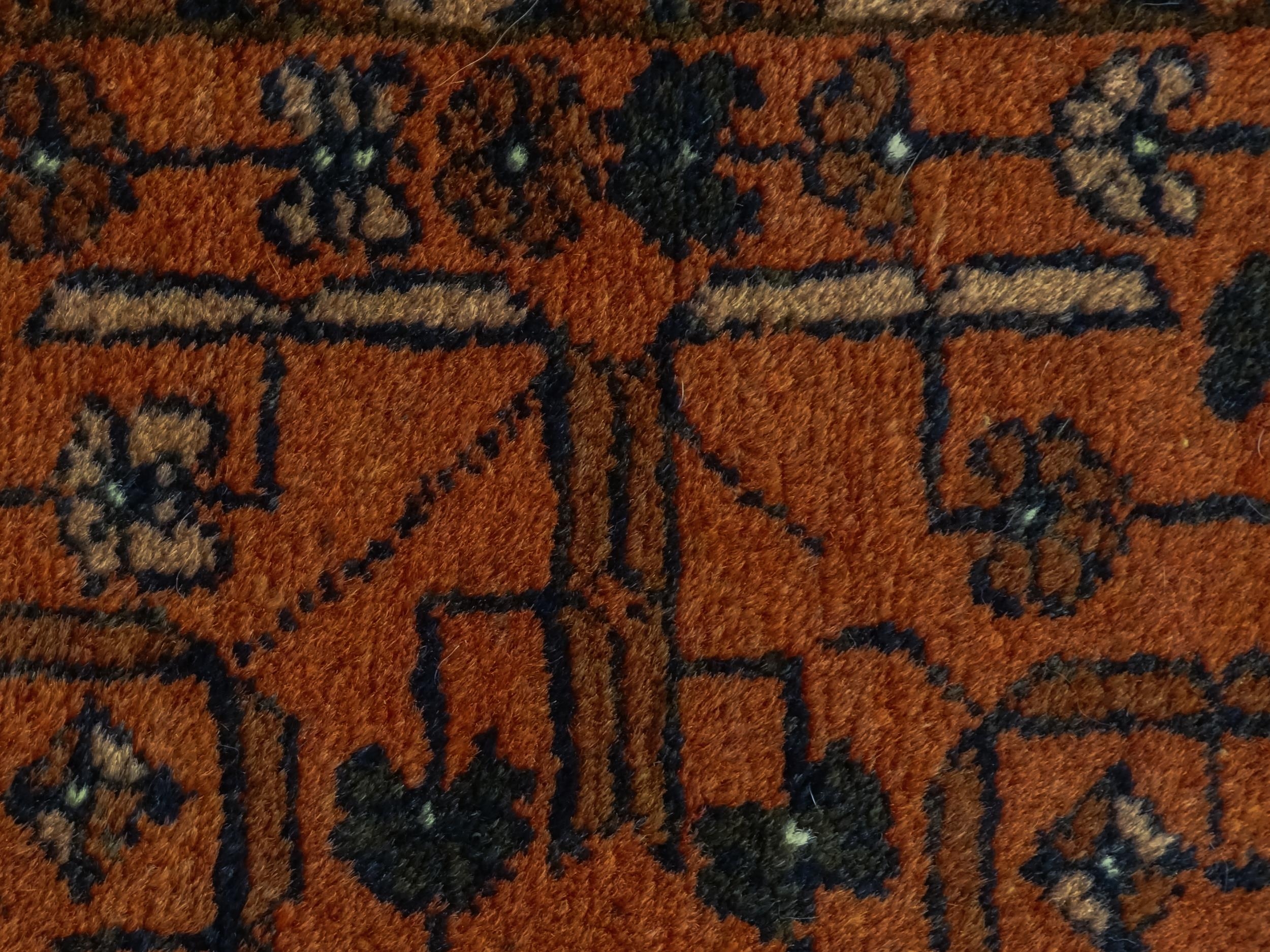 Carpet / Rug: A red ground rug decorated with floral and foliate detail, further repeated to - Image 8 of 8