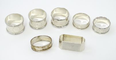 Seven assorted silver napkin rings, various dates and makers to include an Art Deco example