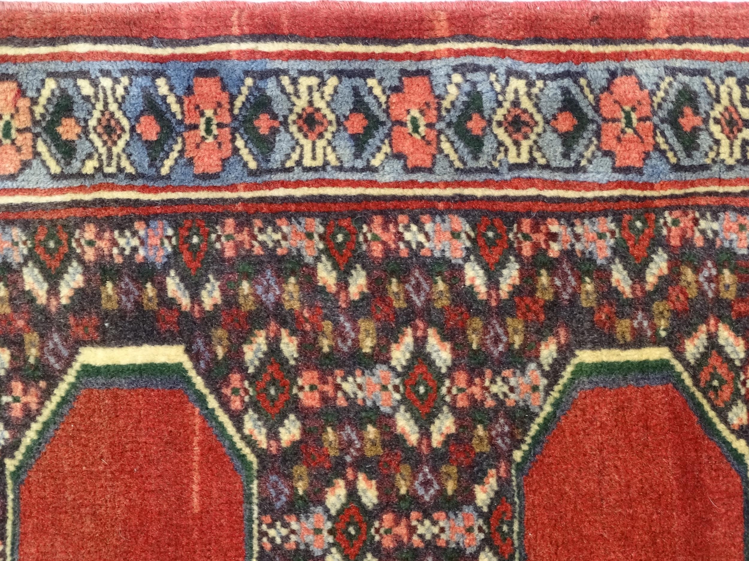 Carpet / Rug : A North West Persian Senneh runner with a red ground decorated with central repeating - Image 6 of 9