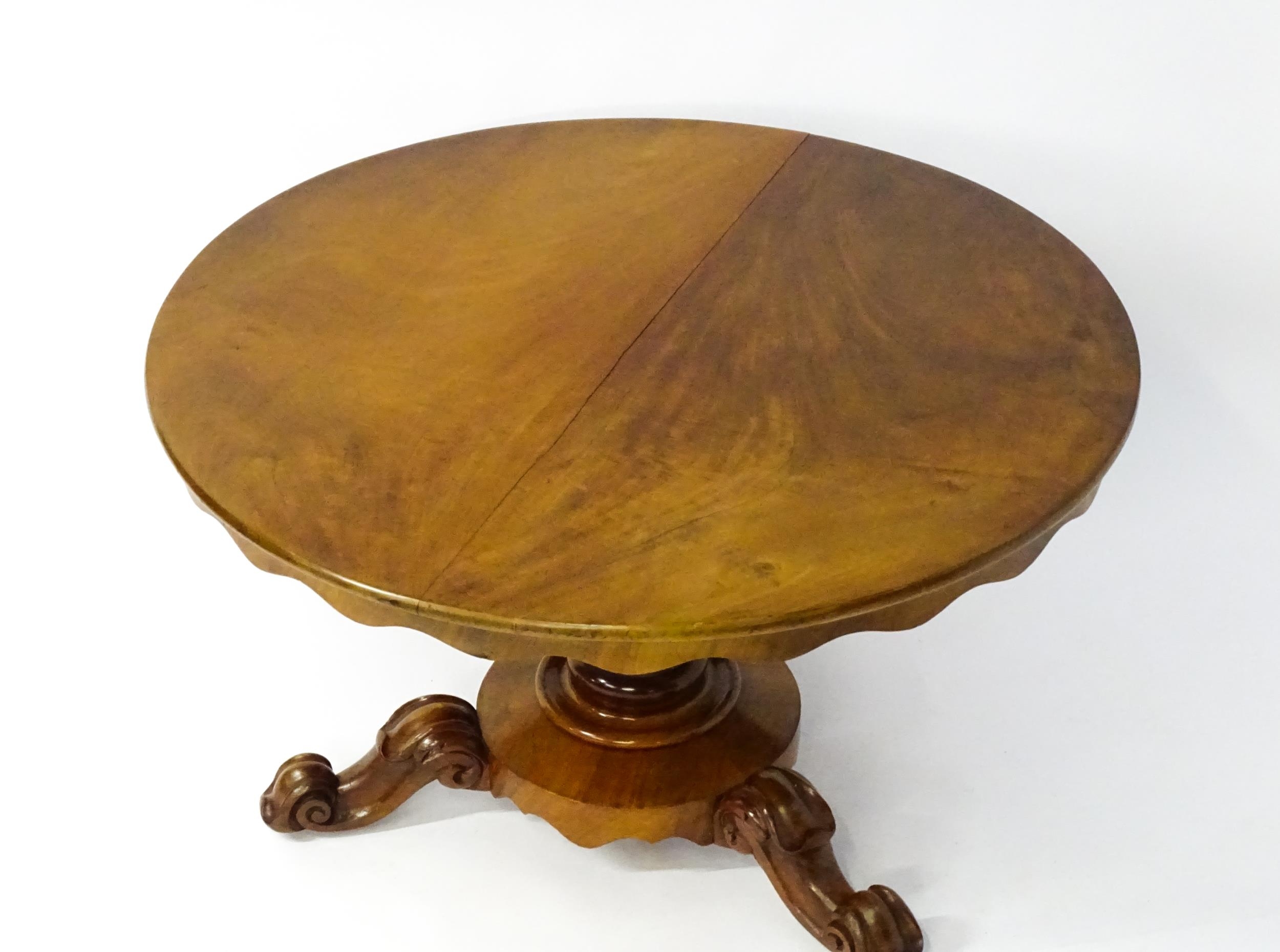 A 19thC mahogany tilt top breakfast table with a carved frieze above a turned and carved pedestal - Image 11 of 11