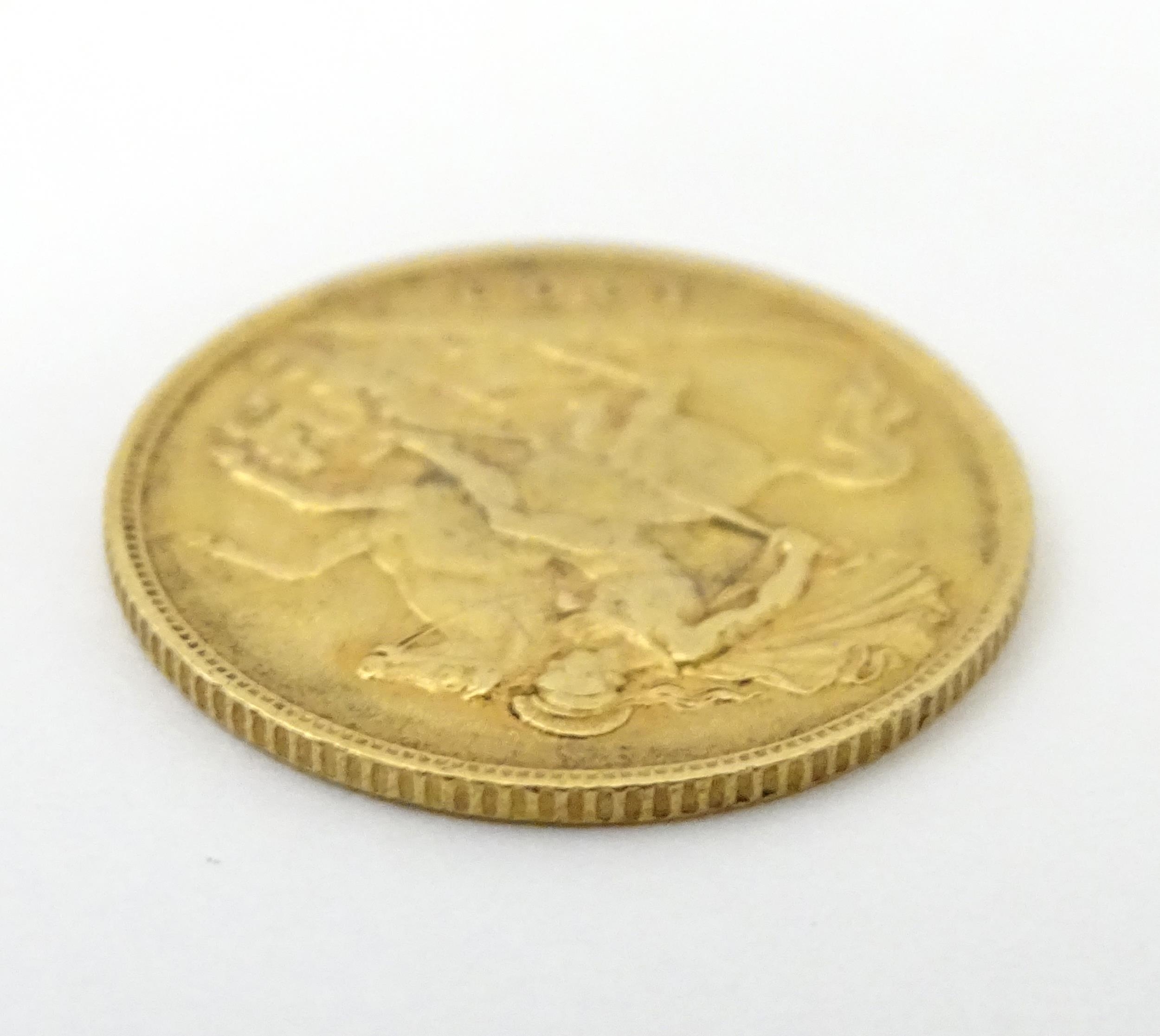 Coin: An Edward VII 1909 gold half sovereign (3.9g) Please Note - we do not make reference to the - Image 2 of 5