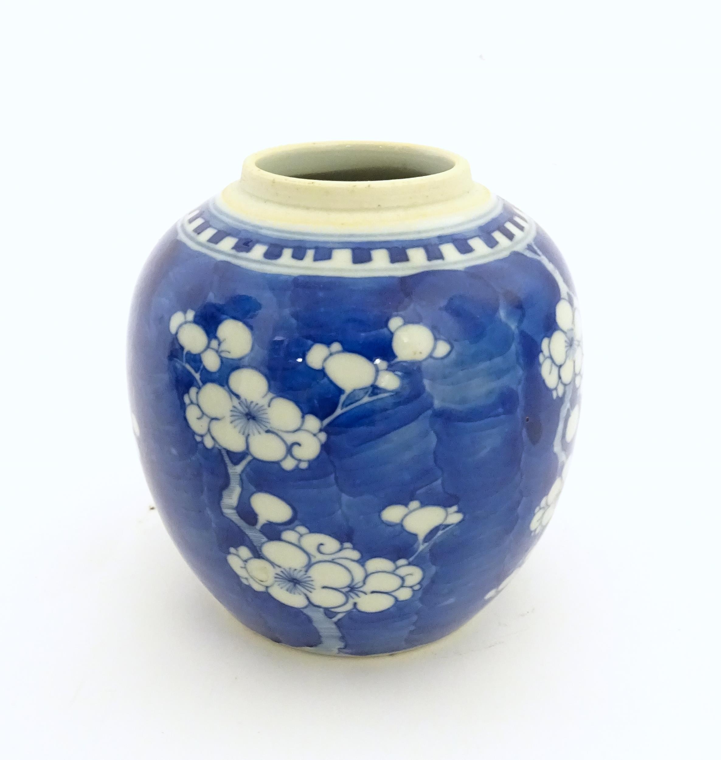 A Chinese blue and white jar decorated with prunus blossom. Character marks under. Approx. 5" high
