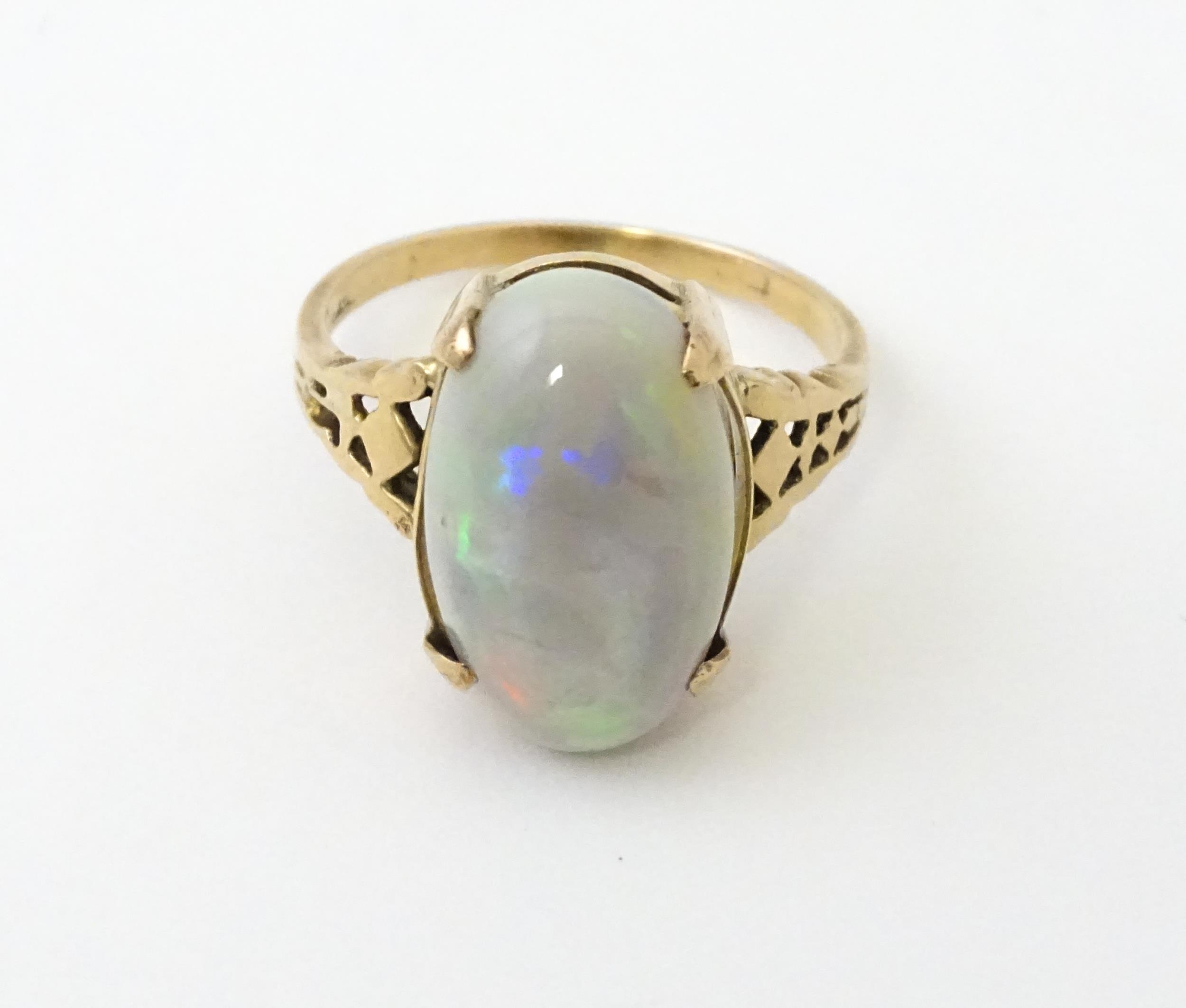 A 9ct gold ring set with large opal cabochon. The opal approx 3/4" long. Ring size approx. 0 - Image 4 of 10