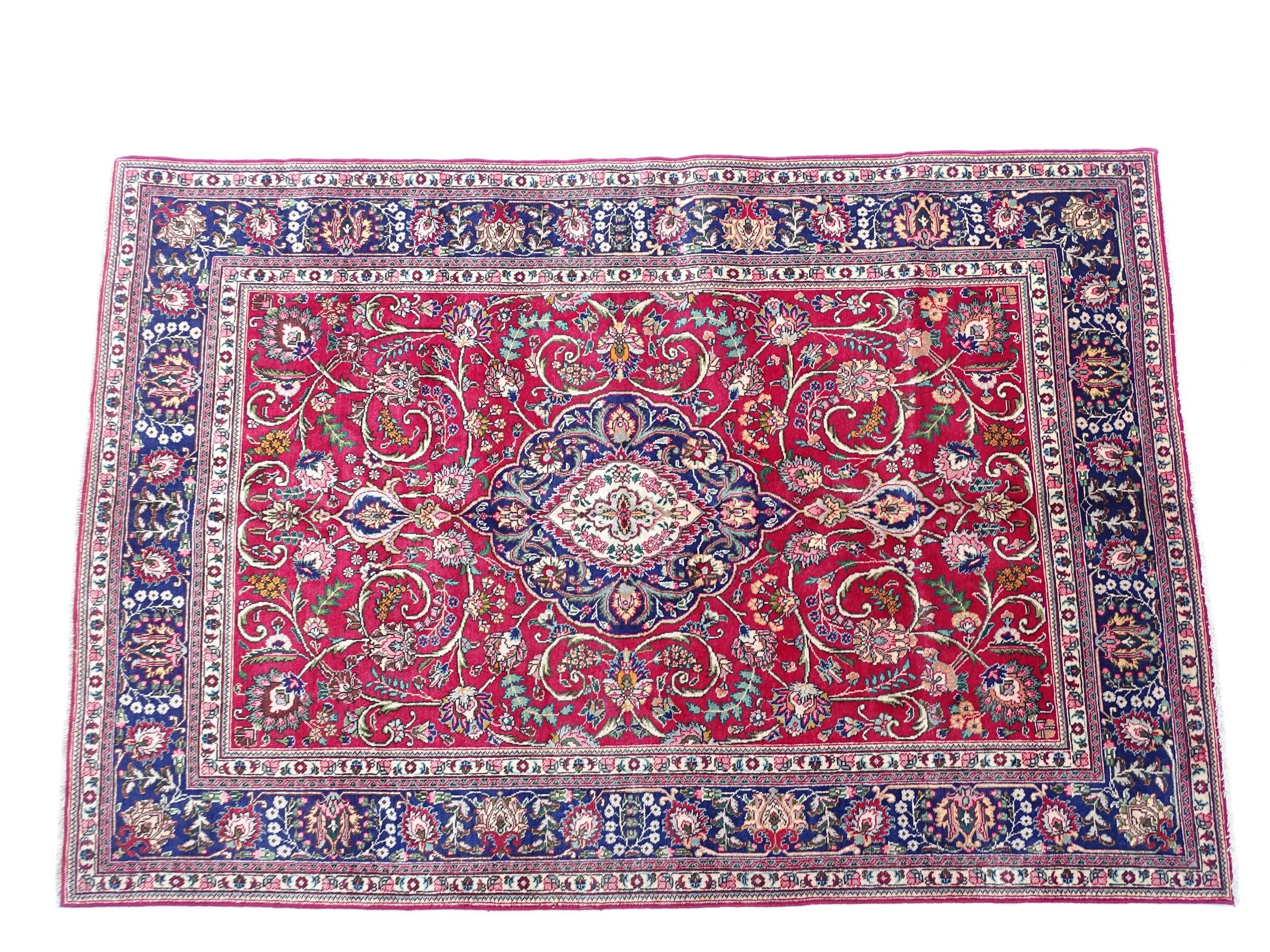 Carpet / Rug: A North West Persian Tabriz carpet the red ground with central cream and blue - Image 3 of 11