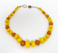 A vintage necklace of graduated amber beads. Approx 24" long Please Note - we do not make