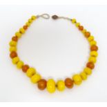 A vintage necklace of graduated amber beads. Approx 24" long Please Note - we do not make