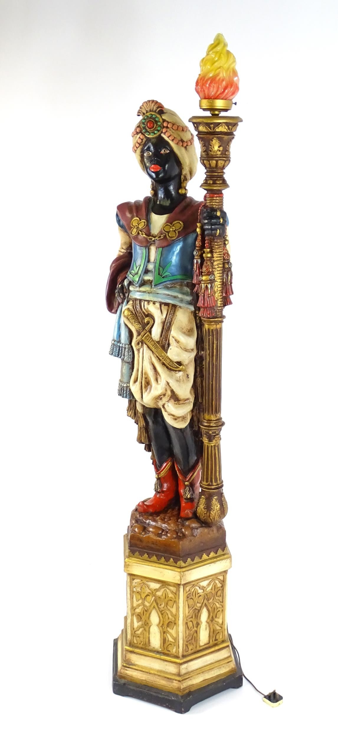 A mid 20thC blackamoor lamp, the lamp having a polychrome figural top grasping a torchiere, the - Image 3 of 14