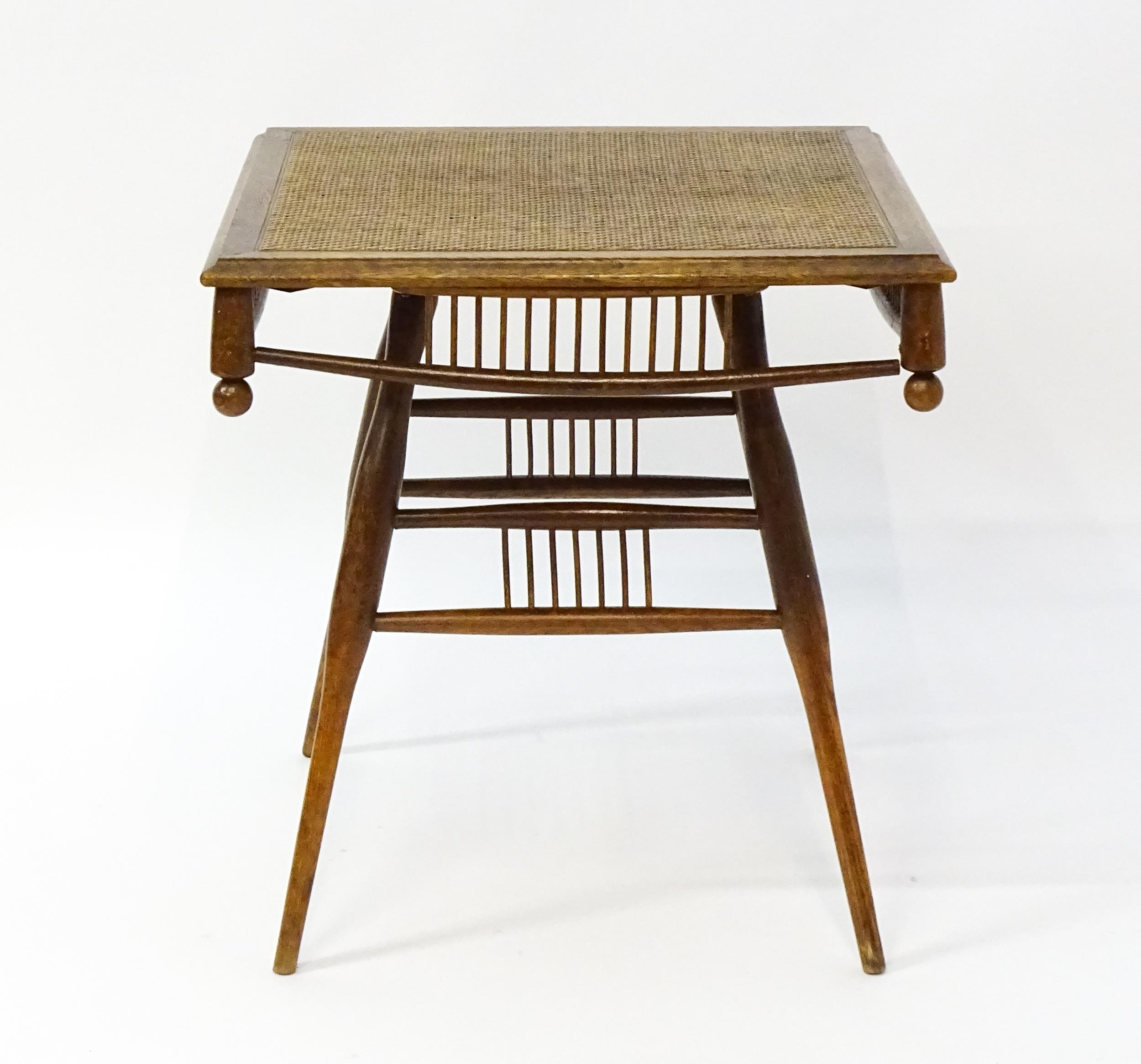 An unusual late 19thC Arts & Crafts table with a rattan inlaid moulded top above three tiers of - Image 8 of 10