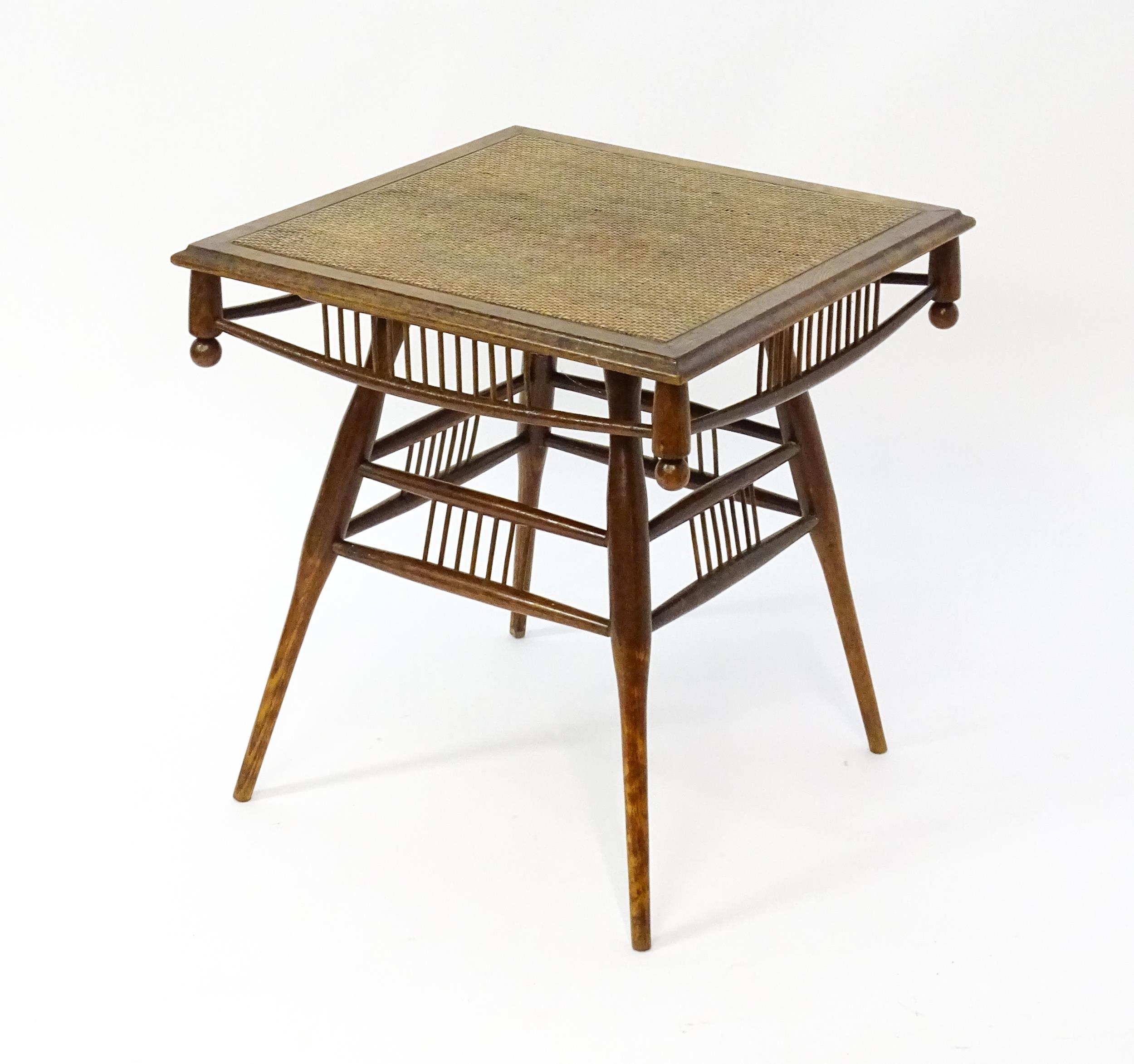 An unusual late 19thC Arts & Crafts table with a rattan inlaid moulded top above three tiers of - Image 7 of 10