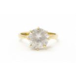 A 9ct gold ring set with a white stone solitaire. Ring size approx. O Please Note - we do not make