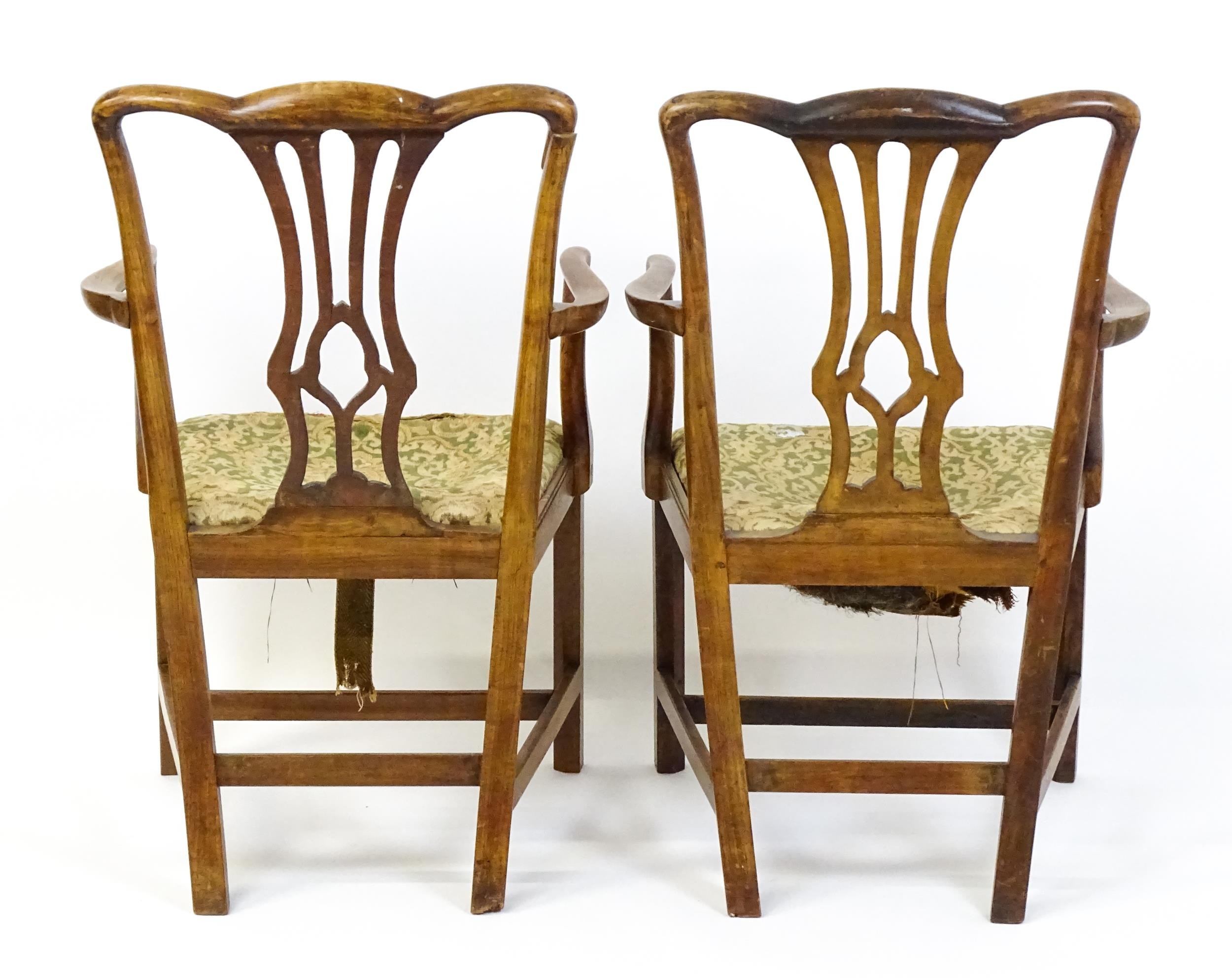 A pair of late 18thC fruitwood elbow chairs with Chippendale back splats, swept arms, drop in - Image 6 of 6