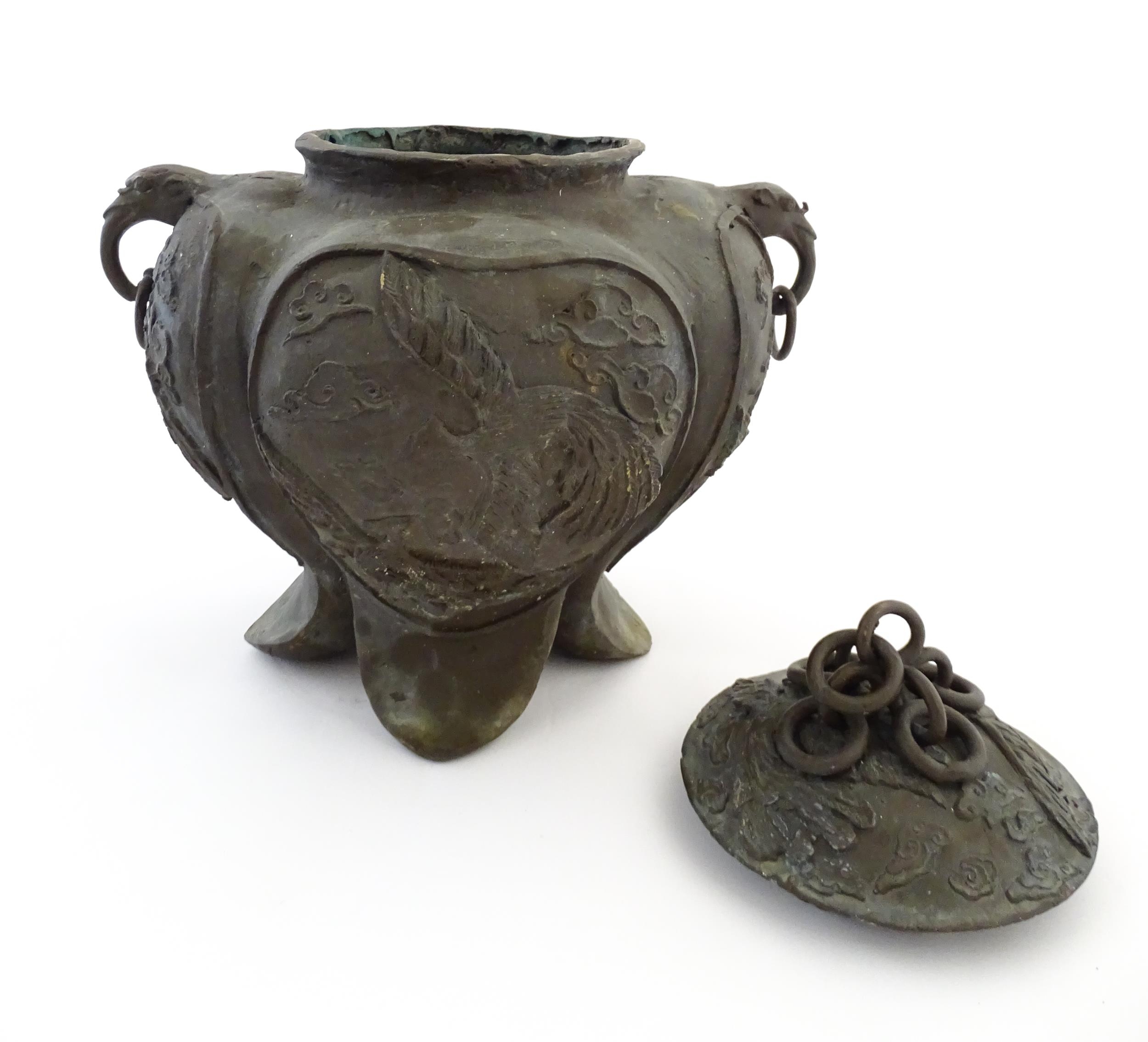 A Chinese cast vessel of lobed form with twin ring handles modelled as elephant heads, the body - Image 4 of 9