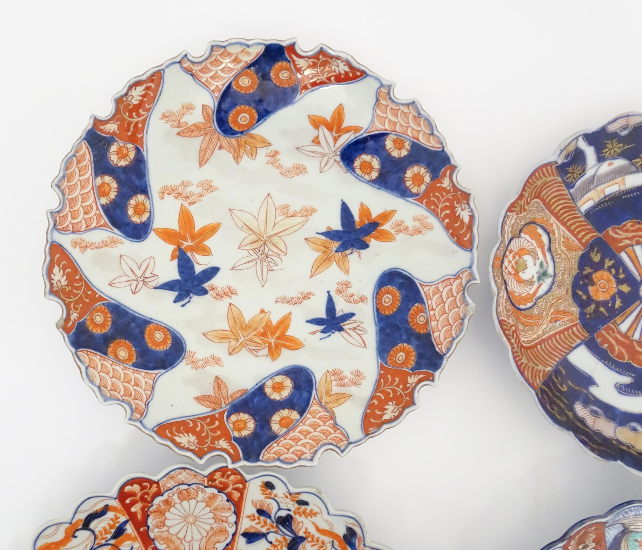 Four Japanese chargers with shaped edges decorated in the Imari palette with flowers, foliage and - Image 7 of 7