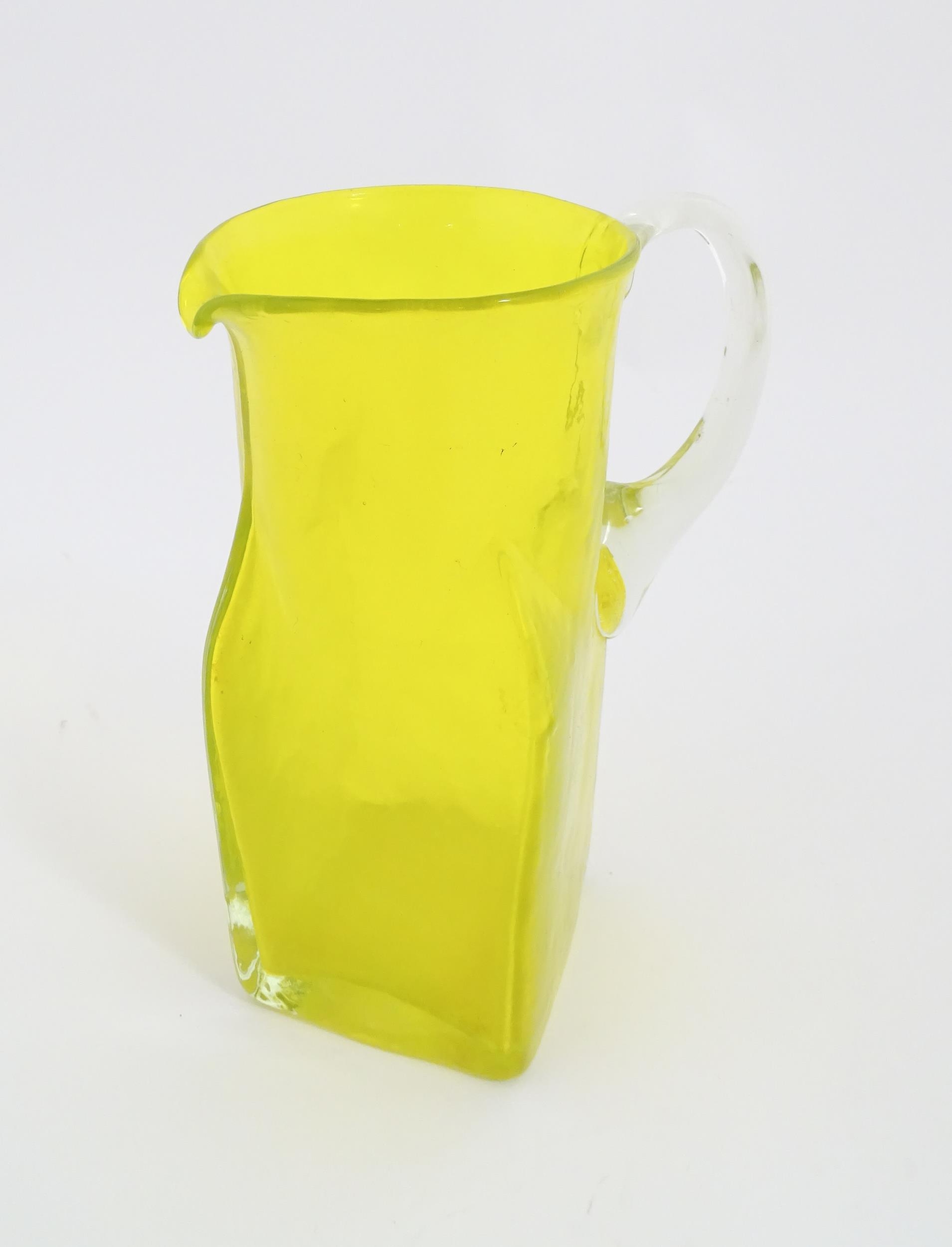 A 20thC yellow glass jug with squared base and clear glass handle. Approx. 8 1/2" high Please Note - - Image 10 of 11