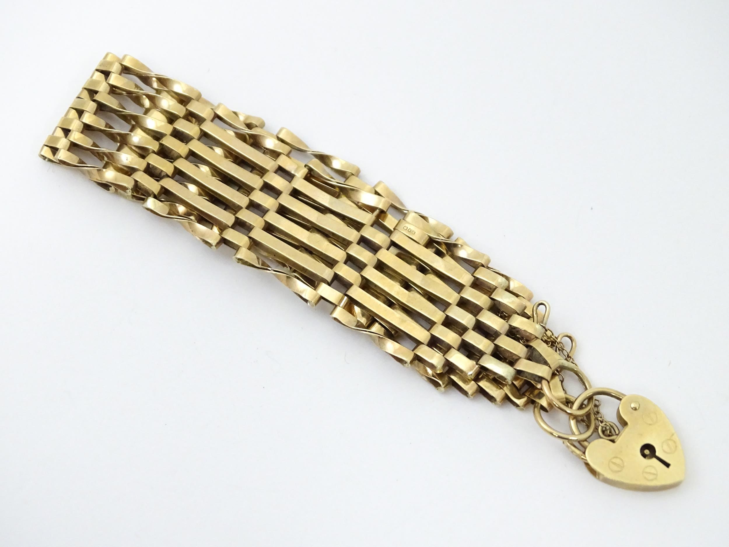 A 9ct gold bracelet with padlock formed clasp. Approx 7 1/2" long x 3/4" wide Please Note - we do - Image 2 of 7