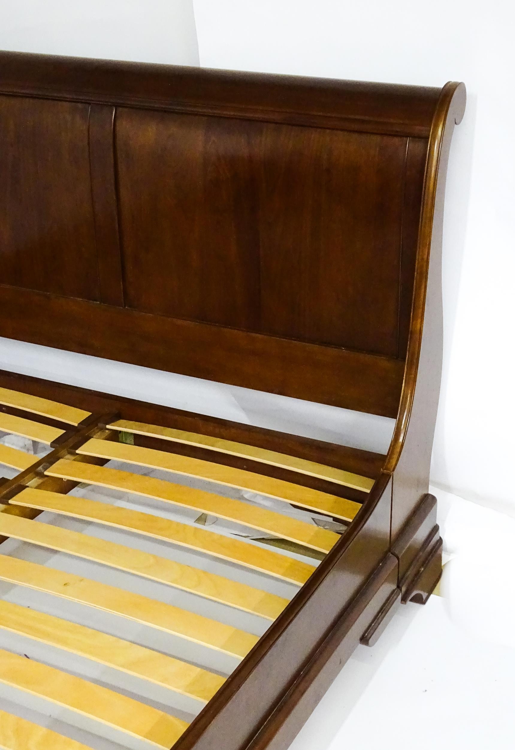 A modern mahogany sleigh bed. 6 1/2ft long x 5ft wide. Please Note - we do not make reference to the - Image 4 of 6