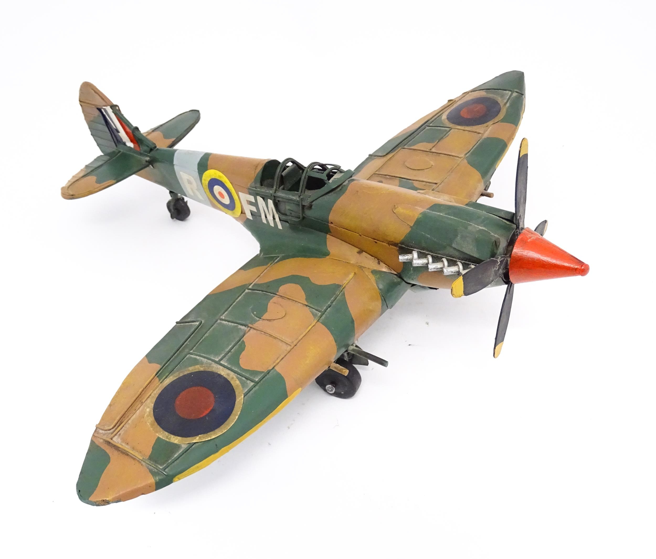 A 20thC scratch built tin plate scale model of a spitfire. Approx. 18" wide Please Note - we do