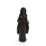 An 18thC carved wooden figure modelled as a lady in prayer. Approx. 8" high Please Note - we do