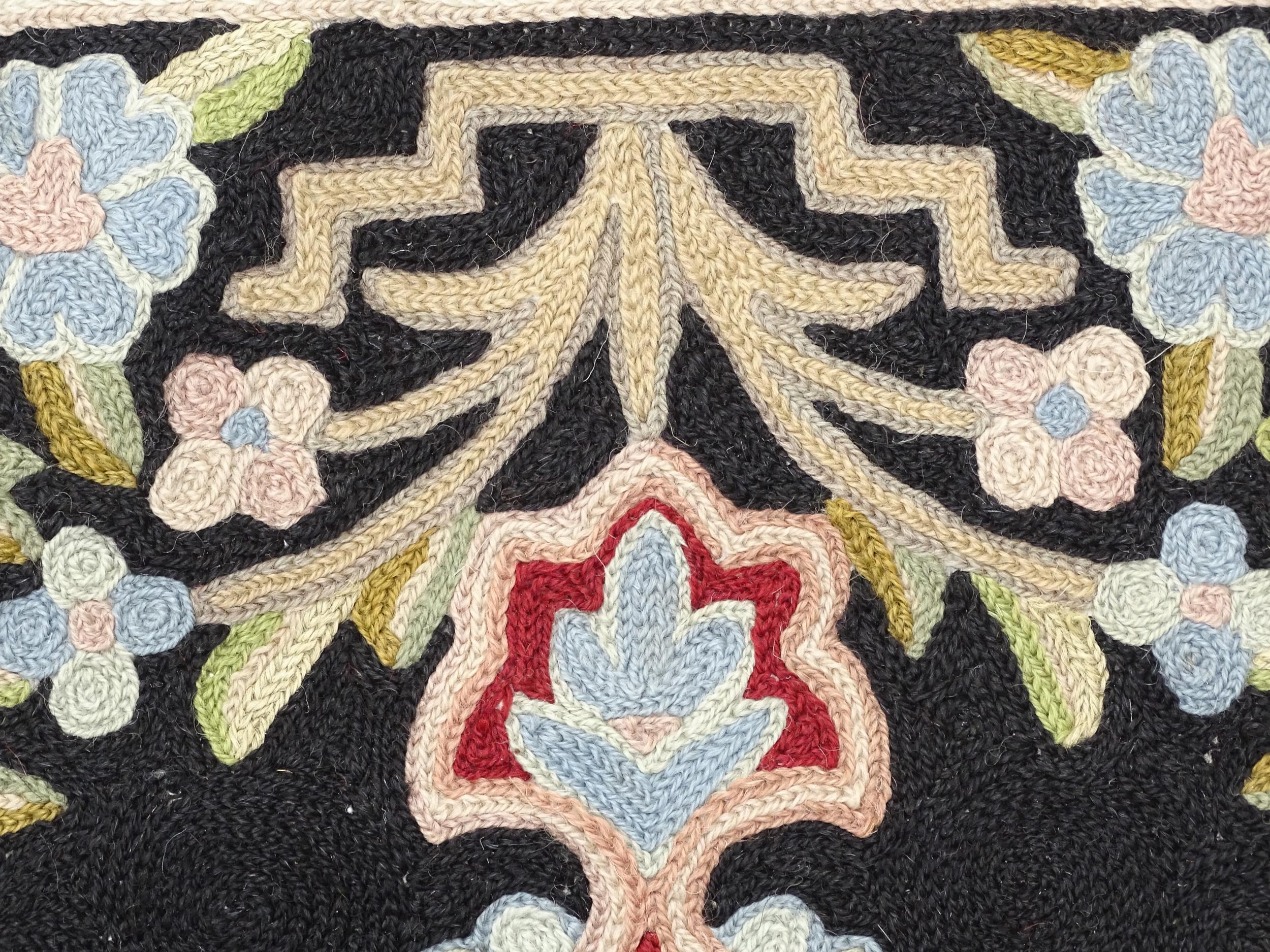 Carpet / Rug : A black and red ground rug with floral and foliate detail. Approx. 35" x 24 1/2" - Image 4 of 7