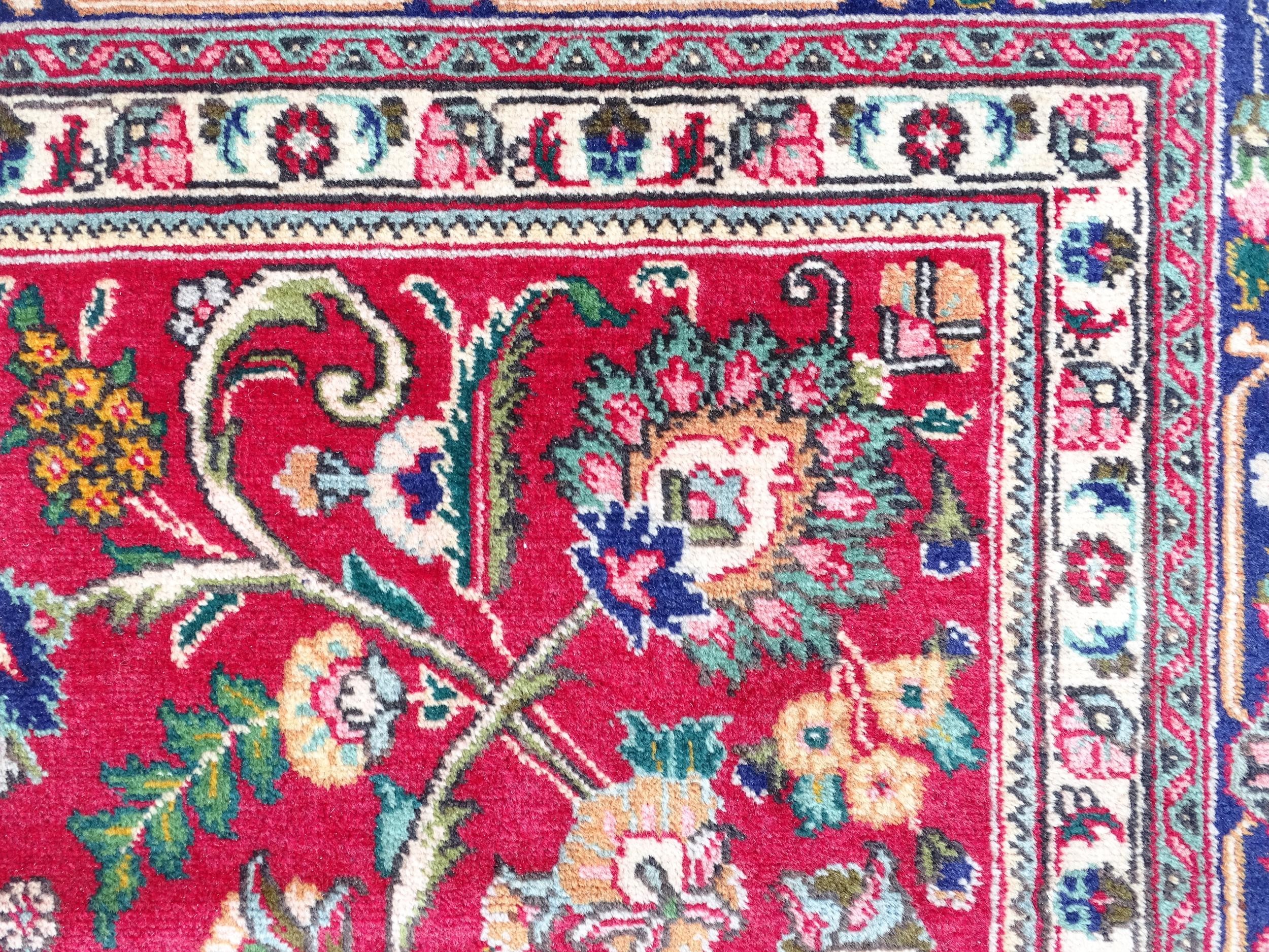 Carpet / Rug: A North West Persian Tabriz carpet the red ground with central cream and blue - Image 5 of 11