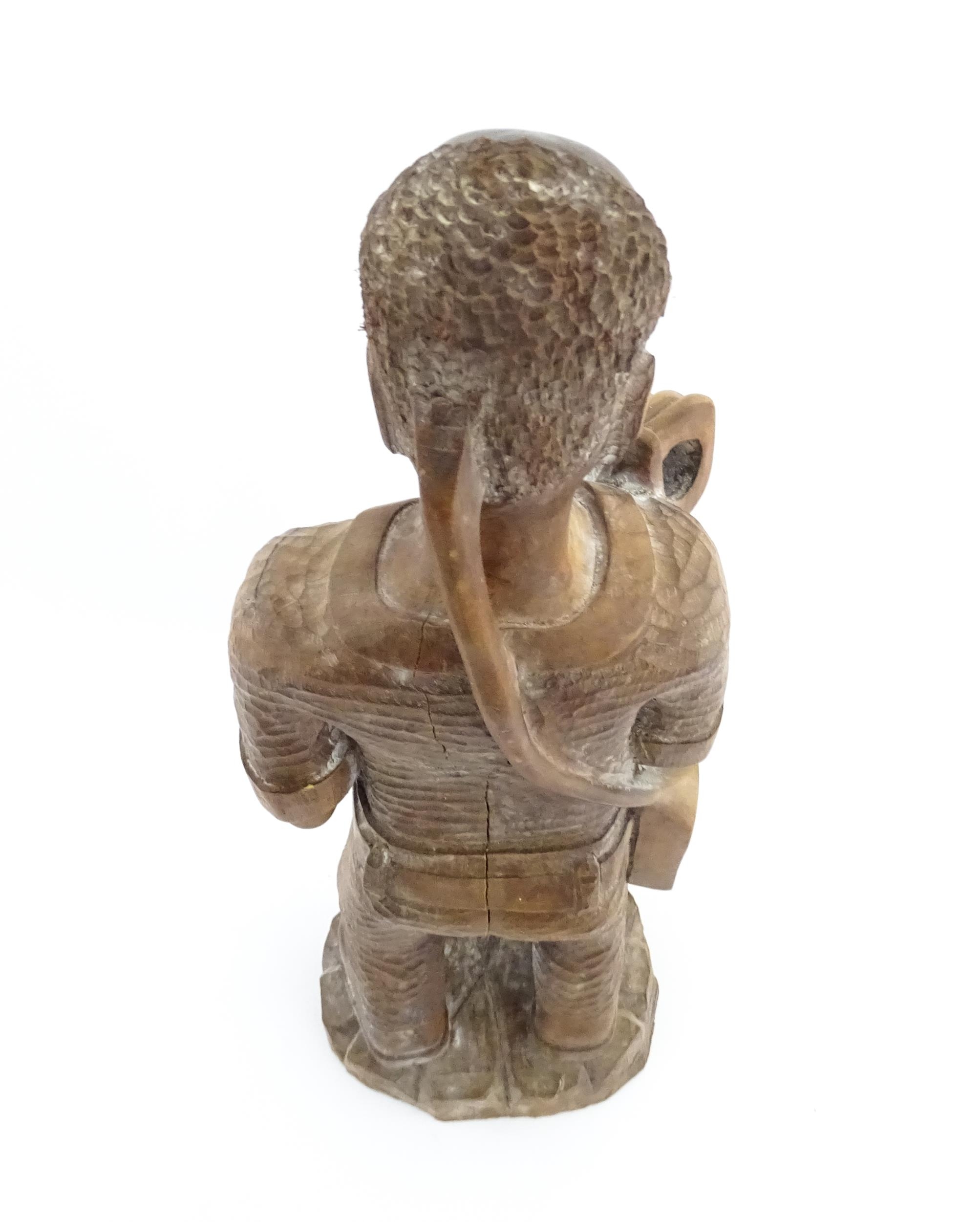 Ethnographic / Native / Tribal: An African carved wood figure modelled as a male farmer with a - Image 6 of 8
