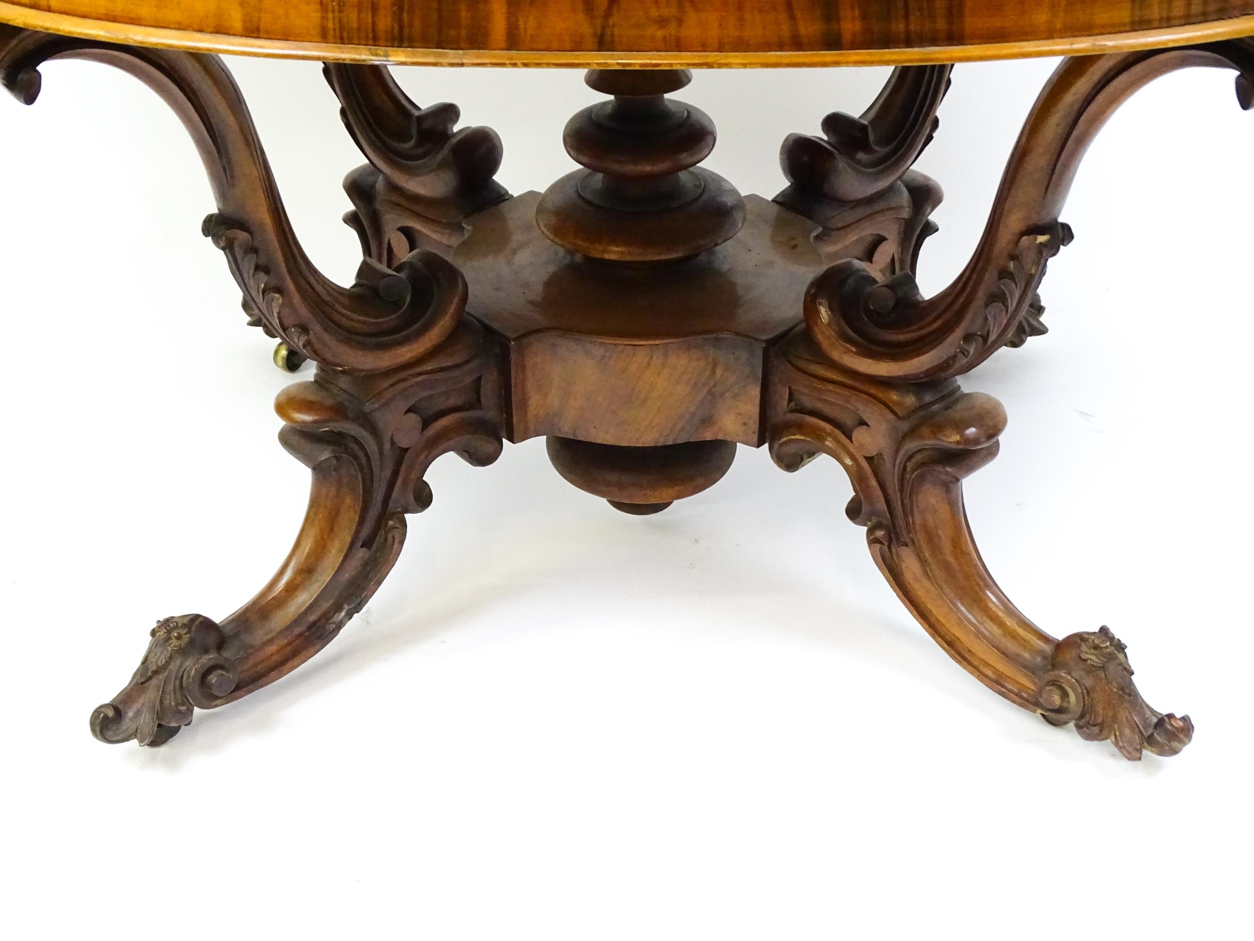 A 19thC burr walnut centre table with a moulded top above four acanthus carved supports, a large - Image 14 of 16