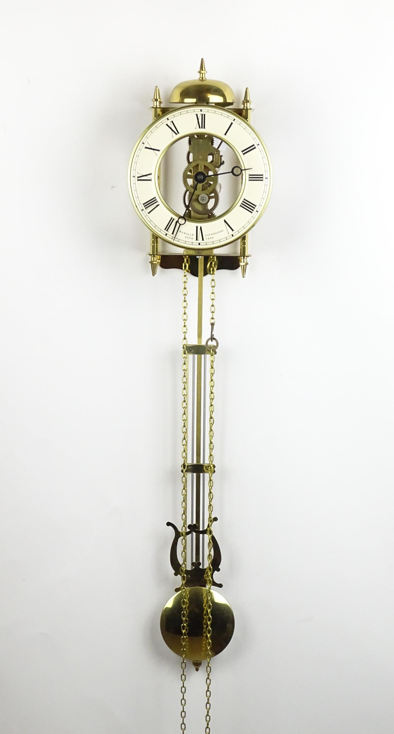 A late 20thC Sewills of Liverpool brass cased skeleton lantern wall clock, circular dial with