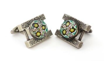 A pair of silver cufflinks with millefiori domed cabochon detail, hallmarked Birmingham 1970 maker