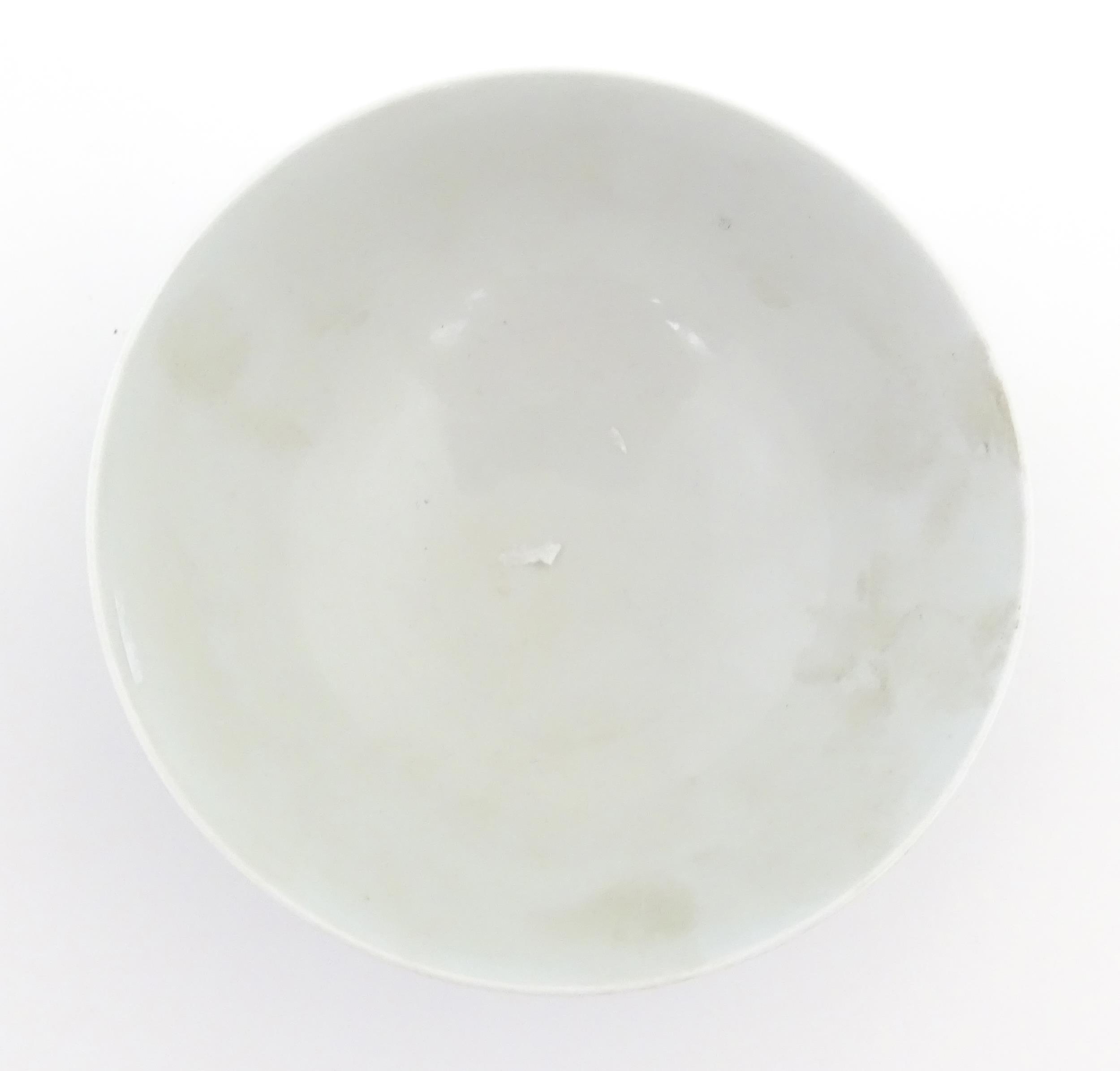 A Chinese bowl with a blue ground decorated with flowers and petals. Character marks under. - Image 5 of 8