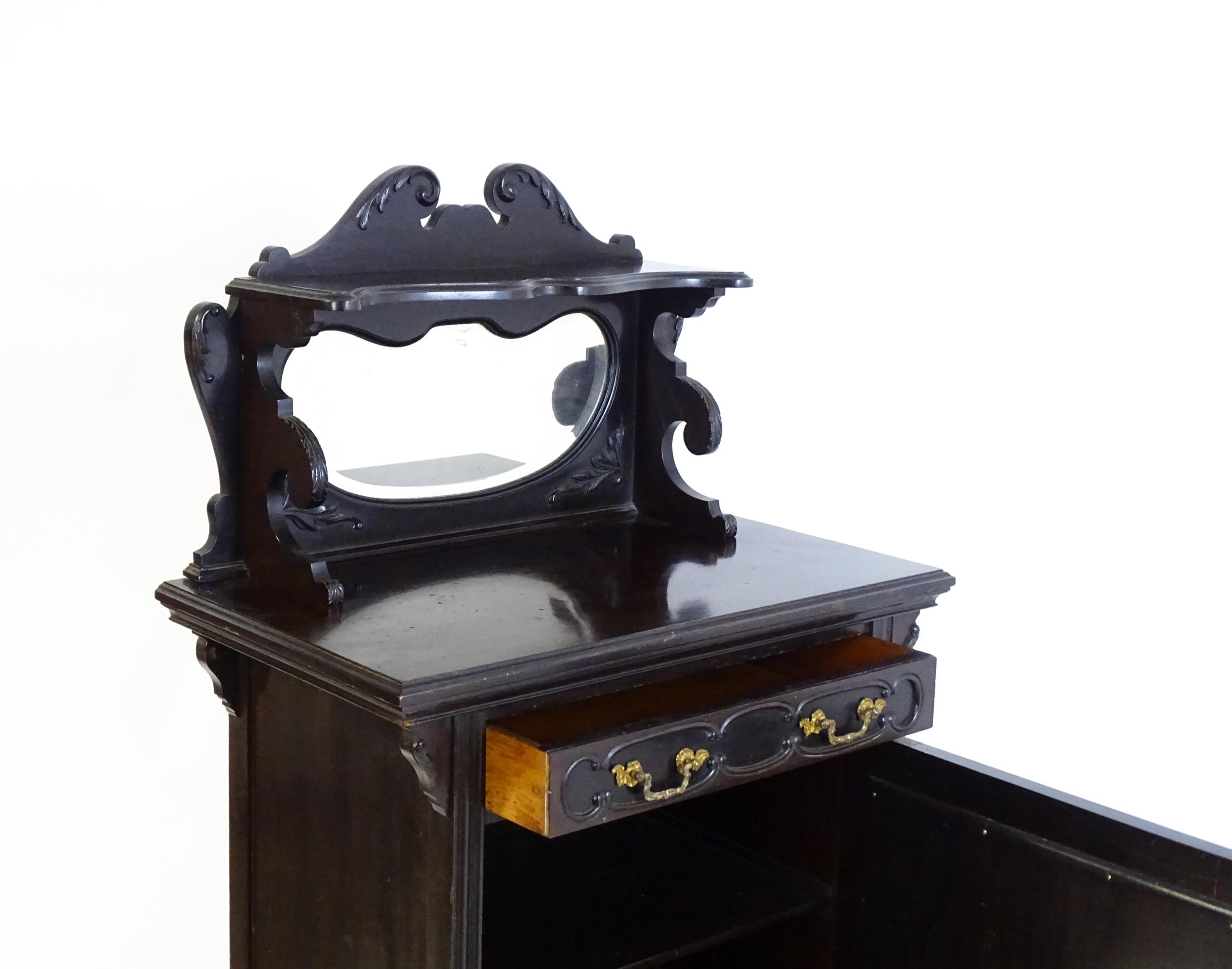 A late Victorian ebonised side cabinet with a mirrored upstand, a moulded top and a single frieze - Image 4 of 6