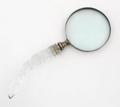 A 20thC magnifying glass with cut glass handle. Approx. 10 3/4" long Please Note - we do not make